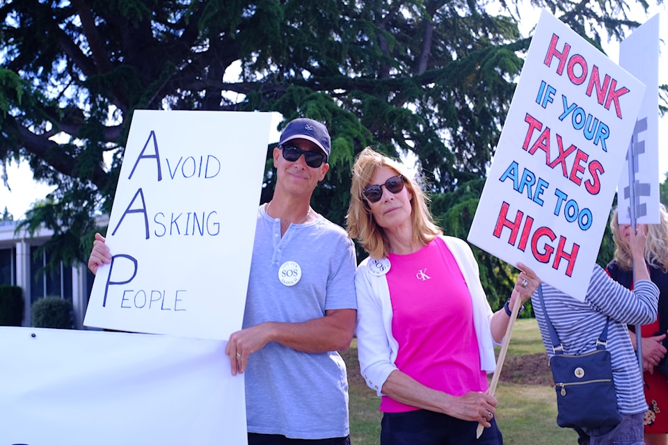 Save Our Saanich’s Stuart Hackett (left) and Nancy Di Castri stand side by side at a protest opposing Saanich’s $150-million AAP.