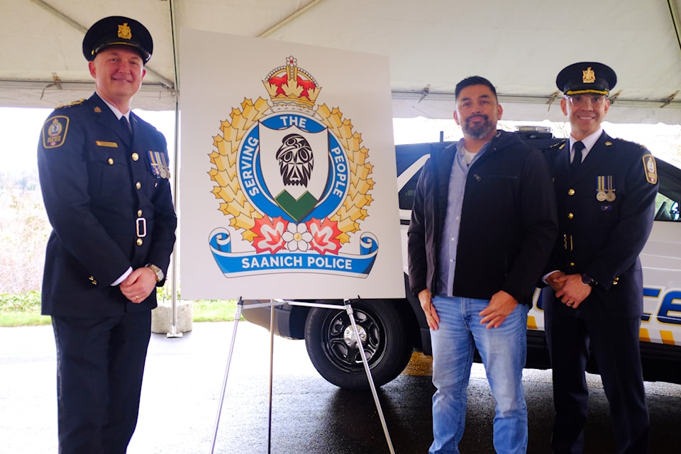 Saanich’s new police crest was unveiled on March 20 by Chief Dean Duthie (left), artist Douglas 'Bear' Horne, and Deputy Chief Constable Darrell Underwood.