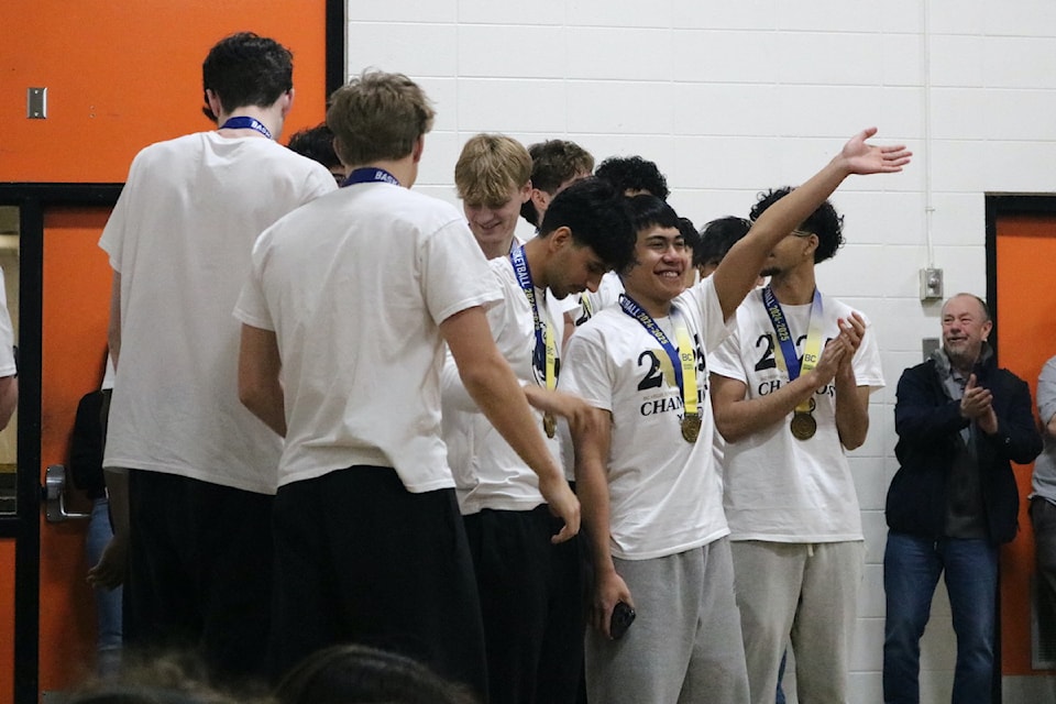 The Thunder celebrating their victory in Spectrum's gymnasium.