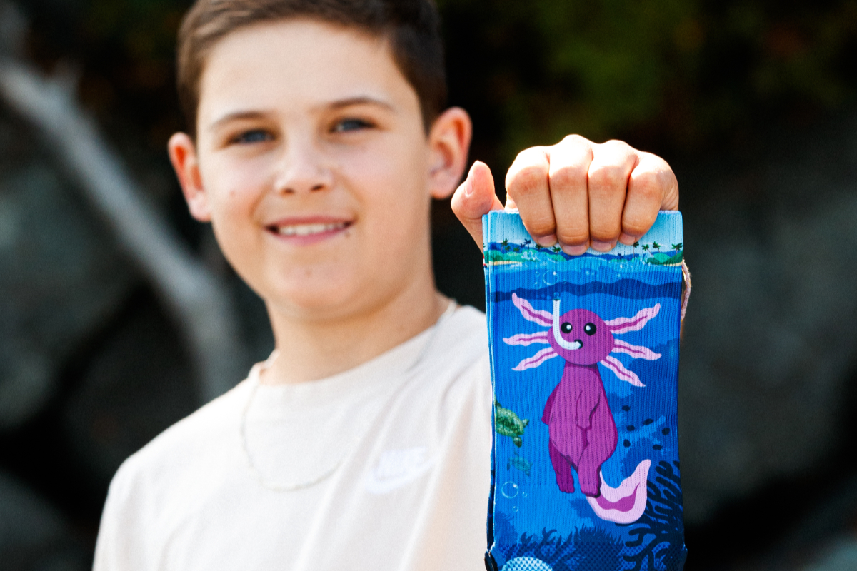 Saanich boy shows laughter is the best medicine with inspiring socks, jokes