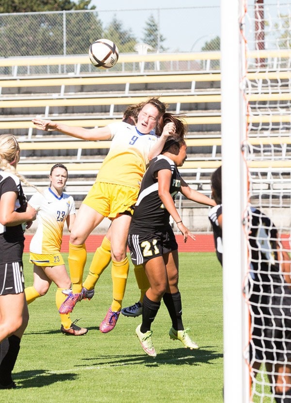 Jacob Zinn/News Staff - Emily Liewen goes for a header during th