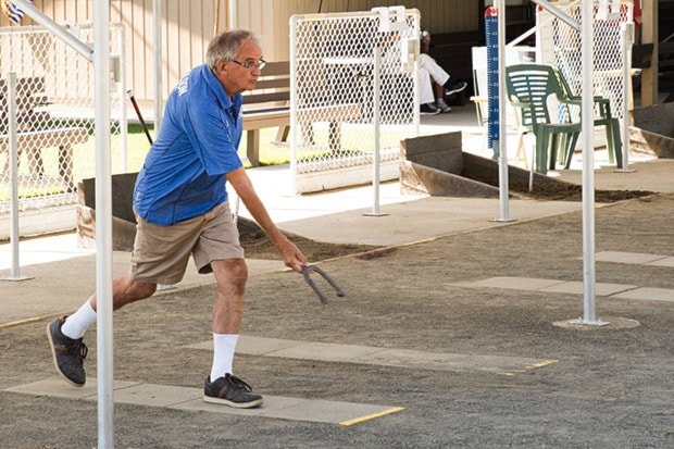 Jacob Zinn/News Staff - Colin Nicholson pitches during practice