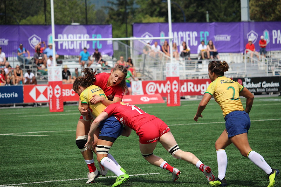 Canada’s Caroline Crossley is tackled by a member of Brazil’s Women’s Rugby Sevens team at the tournament on Saturday. (Shalu Mehta/News Staff)