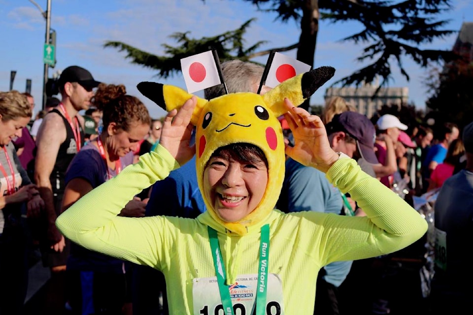 A runner shows off her Pikachu hat at the 40th GoodLife Marathon in downtown Victoria. (Aaron Guillen/News Staff)