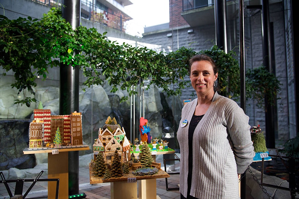 Nov. 14, 2019– Kelly King, director of communications for Habitat for Humanity Victoria stand in front of some of the participants in this year’s Gingerbread Showcase at the Parkside Hotel and Spa. (Nicole Crescenzi/News Staff)