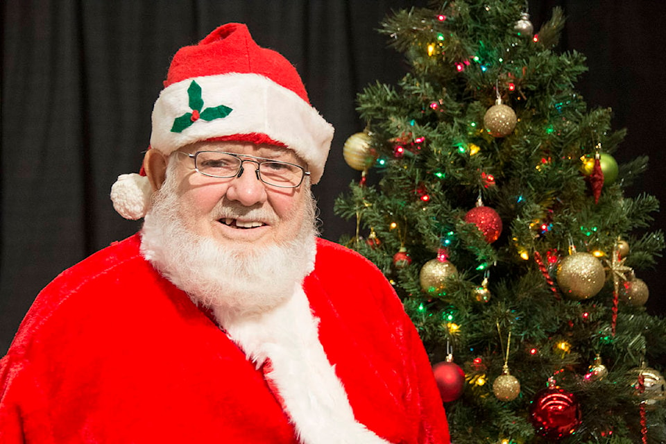 Vern England has been Santa Claus for the Sidney Community Christmas dinner for the last five years. He says his favourite part of the seasonal job is bringing smiles to little ones. (Nina Grossman/News Staff)