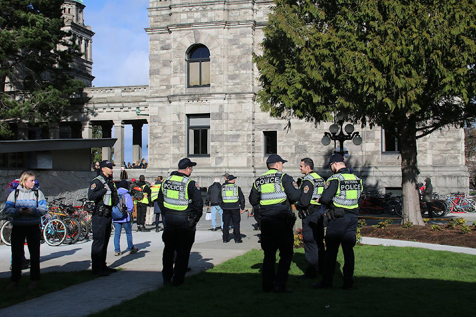A group of Victoria police officers stand by as supporters block entrances to the B.C. Legislature. (Kendra Crighton/News Staff)