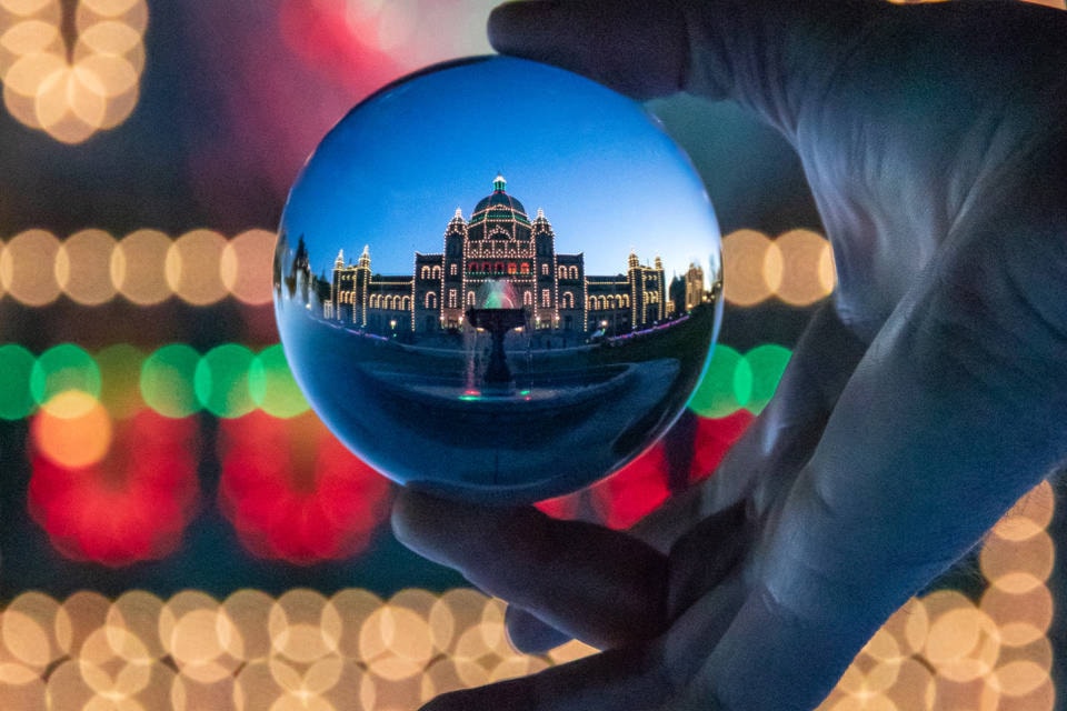 Victoria’s legislative building lit up and captured through a crystal ball. (Cindy Borbridge photo)