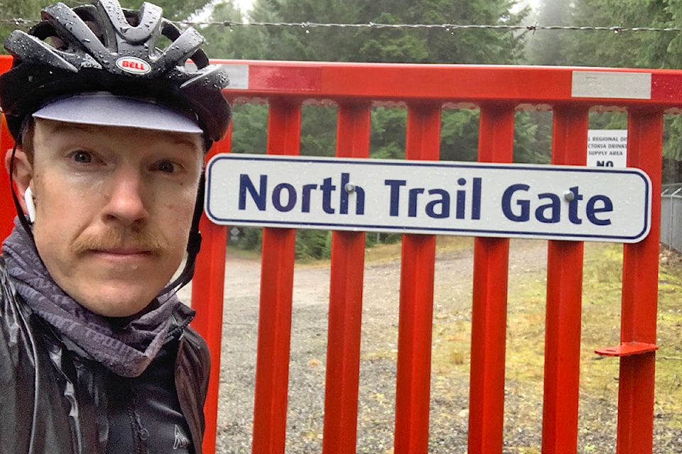 Rob Britton in the rain at the red gates of the Sooke Wilderness Trail turnoff from Niagara Main. (Rob Britton Photo)
