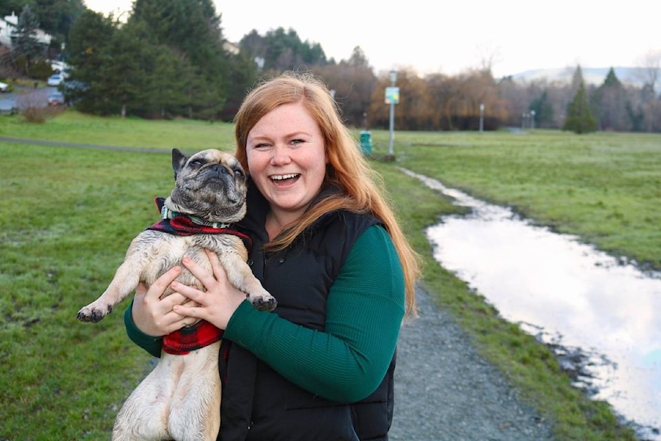 Haley Rietze and her French bulldog Lilo walk through Colwood Creek Park on Jan. 25. (Aaron Guillen/News Staff)