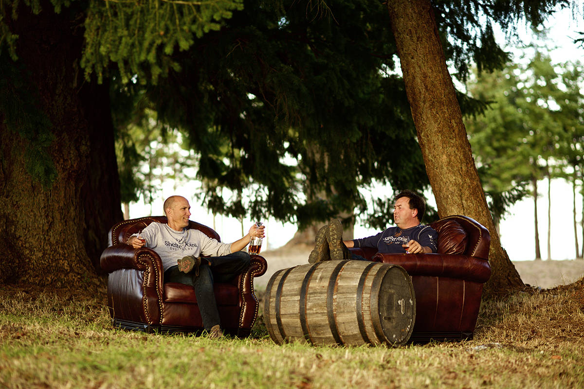 James Marinus, Operations Manager and Patrick Evans, owner of Shelter Point Farm and Distillery enjoy the fruits of their labours
