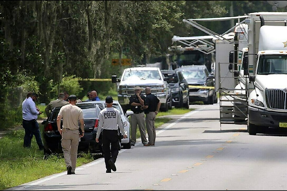Polk County, Fla., Sheriff’s officials work the scene of a multiple fatality shooting Sunday, Sept. 5, 2021, in Lakeland, Fla. Four people are dead including a mother who was still cradling her now deceased baby in what Florida sheriff’s deputies are calling a massive gun battle with a suspect. (Michael Wilson/The Ledger via AP)t
