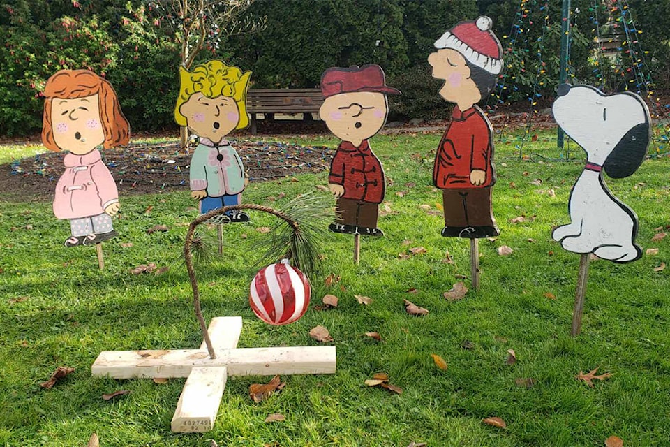 The Peanuts gang hangs out in Oak Bay’s Entrance Park. (Photo by Tim Roberts)