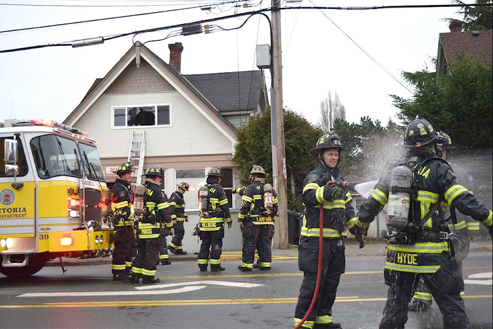 Firefighters with the Victoria Fire Department respond to a kitchen fire in the 2000-block of Cook Street. (Kiernan Green/News Staff)