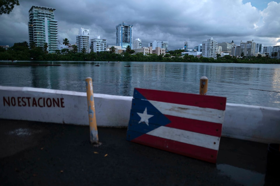 28357301_web1_220304-CPW-Arrest-BC-fugitive-stuns-PuertoRico-flag_1