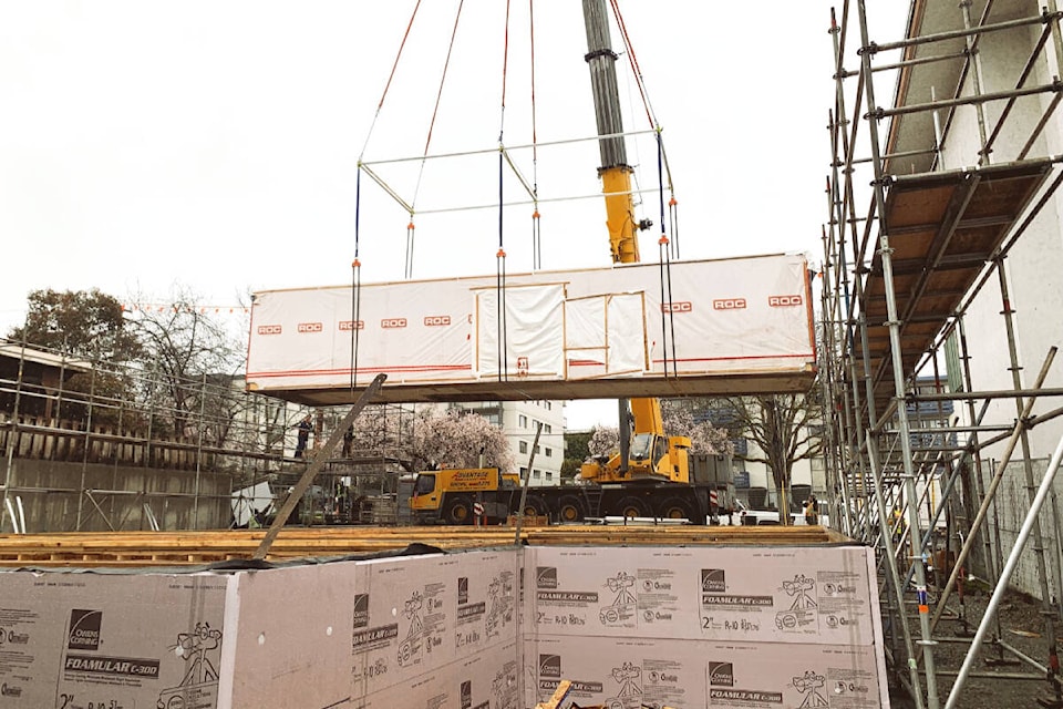 The first modular units are installed for a BC Housing project at 1176 Yates St. in Victoria. (BC Housing/Facebook)