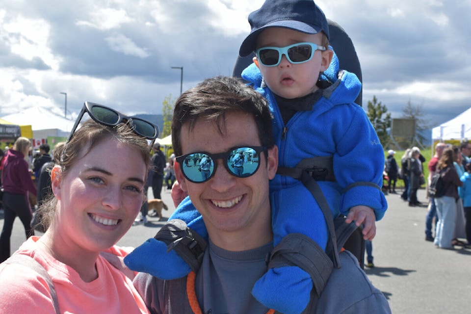Riley and Bobby Eng with their son Arrow were among the 2,500-plus visitors to the first Sidney Farmer’s Market of the season, held Sunday in the parking lot of the Mary Winspear Centre. (Wolf Depner/News Staff)