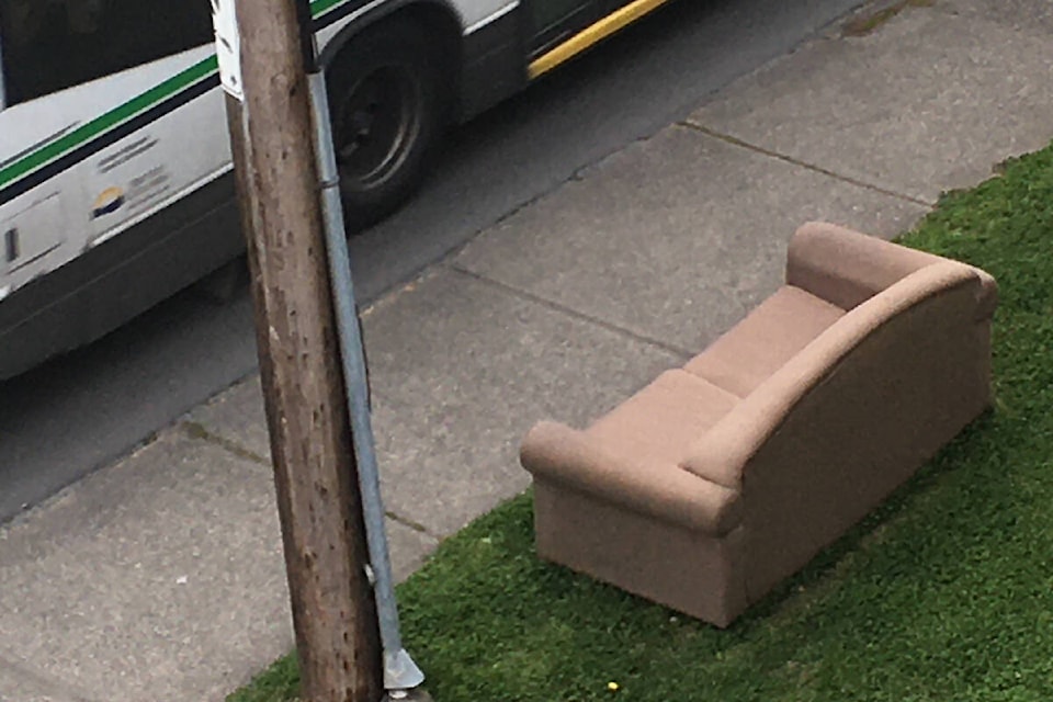 A roadside dump of a couch in Saanich where the district spent nearly $30,000 on similar cleanup in the first four months of the year. (Christine van Reeuwyk/News Staff)