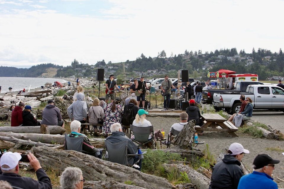 Crowds lounge on the beach as Pulse Radio performs at the Esquimalt Lagoon Saturday (July 9) as part of Colwood’s weekly beach food weekends and Saturday music. (Justin Samanski-Langille/News Staff)