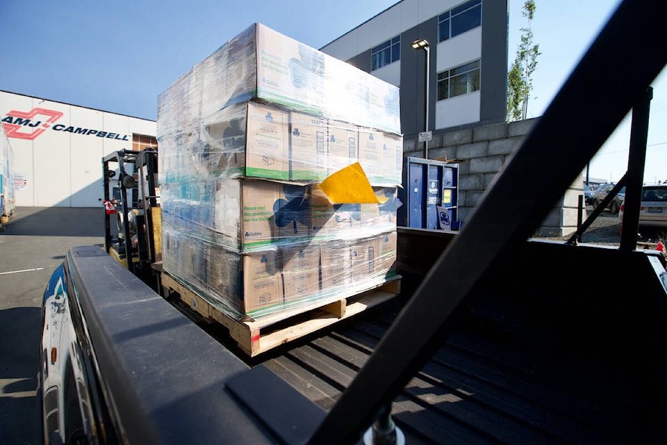 Cases of Girl Guide cookies were loaded into cars by the pallet load in some cases Saturday (Sept. 10) as the fall cookie sale gets underway with the return of ever-popular chocolate mint cookies. (Justin Samanski-Langille/News Staff)