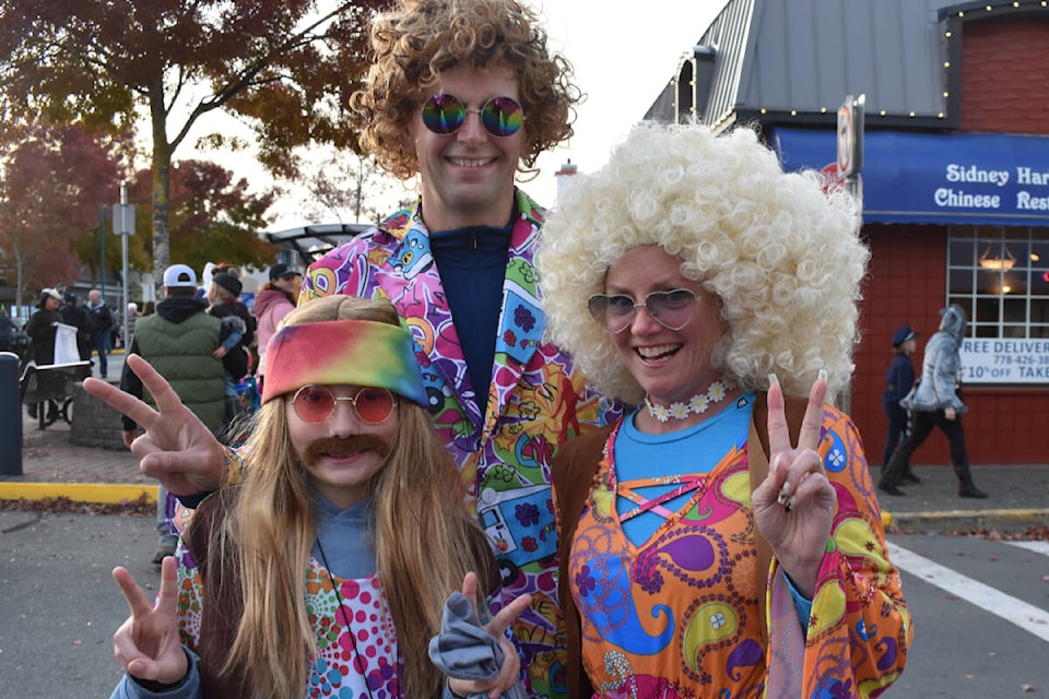 Tom Ried and his parents Jason and Maureen channelled the groovy 1960s as Beacon Avenue in downtown Sidney closed down for Treat Street.