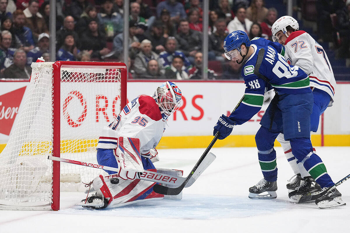 Canucks rally from three-goal deficit but fall short in overtime