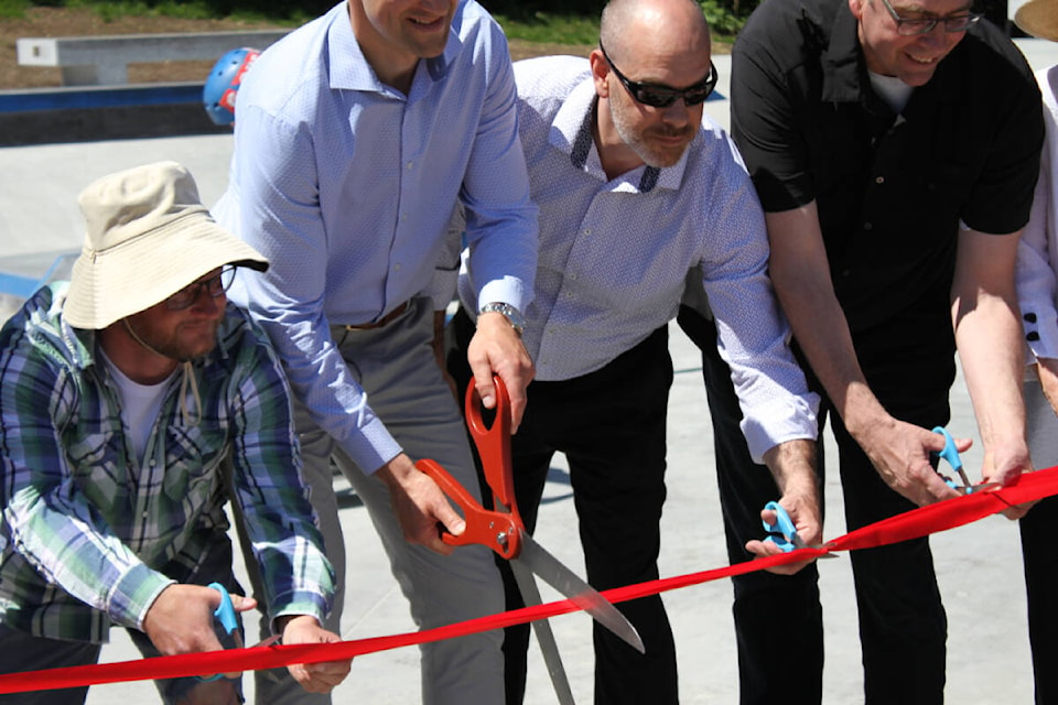 Westshore Skatepark Coalition member Jimmy Miller cuts the ribbon alongside West Shore mayors and councillors at the Thrifty Foods Skatepark grand opening at West Shore Parks and Recreation in Colwood May 13. (Austin Westphal/News Staff)