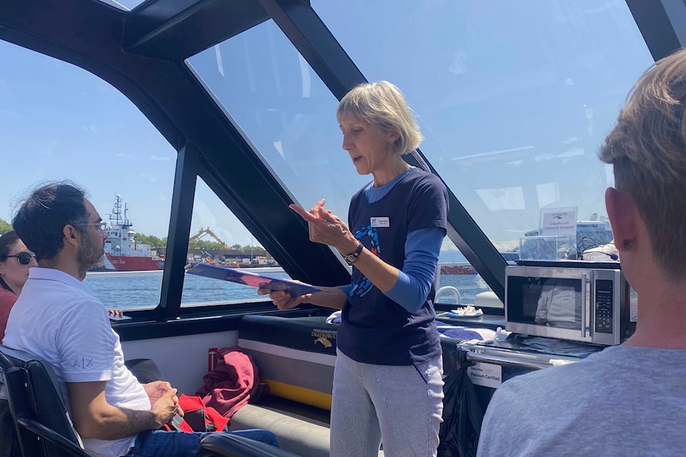 Ocean week organizer Heather Murray telling her crew about various housekeeping items. (Ella Matte/News Staff)