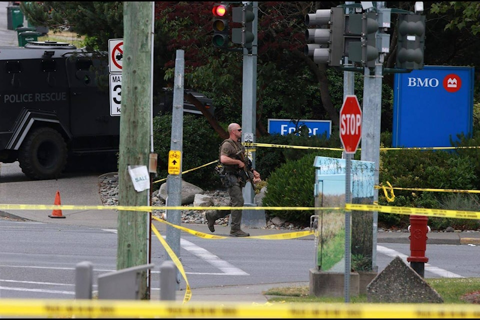 Saanich Police joined by Victoria Police and RCMP respond to shots of gunfire involving multiple people and injuries reported at the Bank of Montreal during an active situation in Saanich, B.C., on Tuesday, June 28, 2022 THE CANADIAN PRESS/Chad Hipolito Saanich Police joined by Victoria Police and RCMP respond to shots of gunfire involving multiple people and injuries reported at the Bank of Montreal during an active situation in Saanich, B.C., on Tuesday, June 28, 2022. THE CANADIAN PRESS/Chad Hipolito