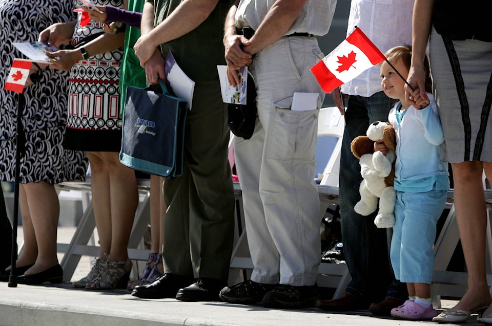33185383_web1_230630-CPW-Ukrainian-newcomers-Canada-Day-parade_1