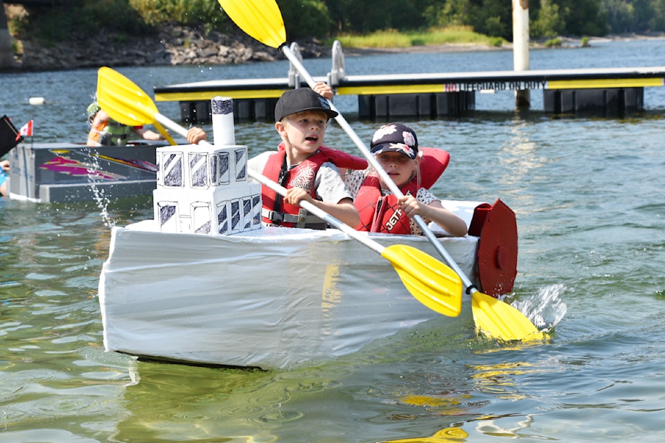 Siblings August, front, and Elise Shannon, who recently moved from Sweden to Calgary, had a successful first voyage to win the  under 11 Cardboard Boat Race at the Family Fun Day on Saturday, Aug. 3.
