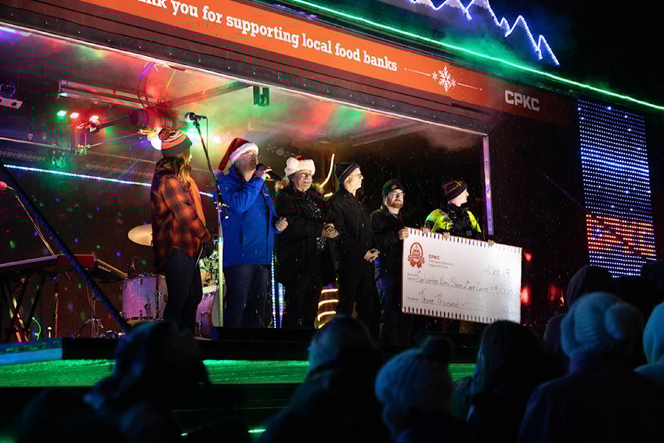 Salmon Arm Salvation Army Lt. Joel Torrens, accompanied by Salmon Arm Mayor Alan Harrison, Salmon Arm-Shuswap MLA Dennis Williams and Shuswap MP Mel Arnold, receives a donation from CPKC for $3,000 during during the Holiday Train's stop in Canoe  on Tuesday, Dec. 17, 2024.  A $7,000 donation to the Salvation Arm was presented during the train's downtown Salmon Arm stop. 