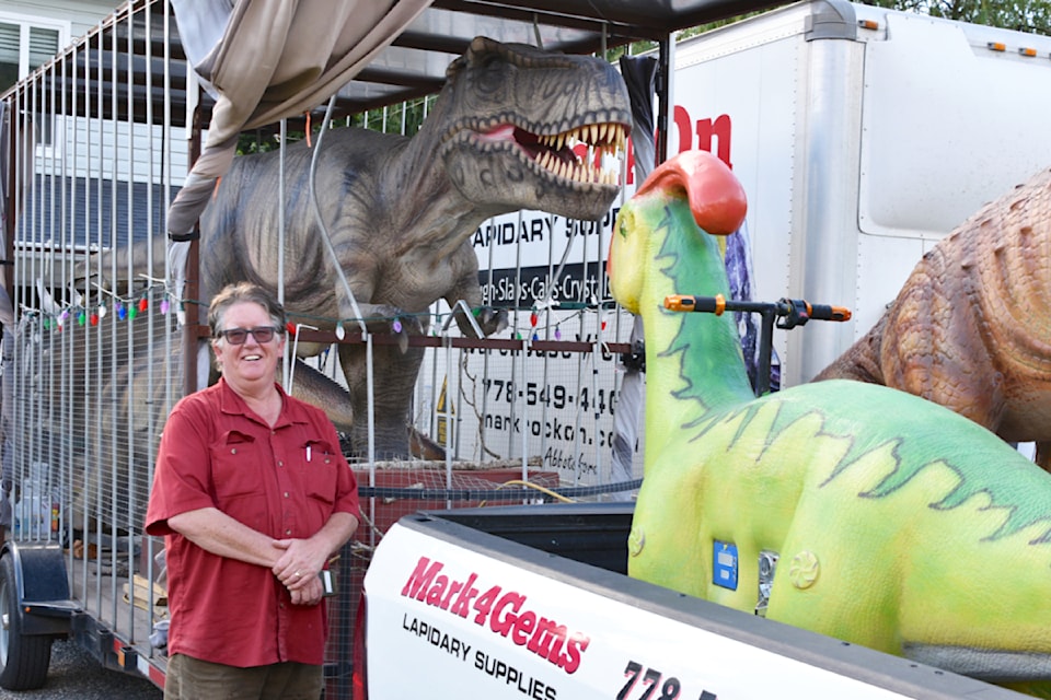 "I'm kind of addicted," Mark de Bruijn, left, admits of his Jurassic collection that all started with a toothy T-Rex.