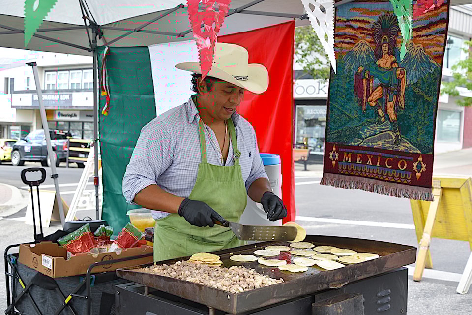 Ivan Gracia turns his tortillas while making traditional Mexican food at the Gathering Together Festival held in downtown Salmon Arm on Multiculturalism Day, Thursday, June 27.