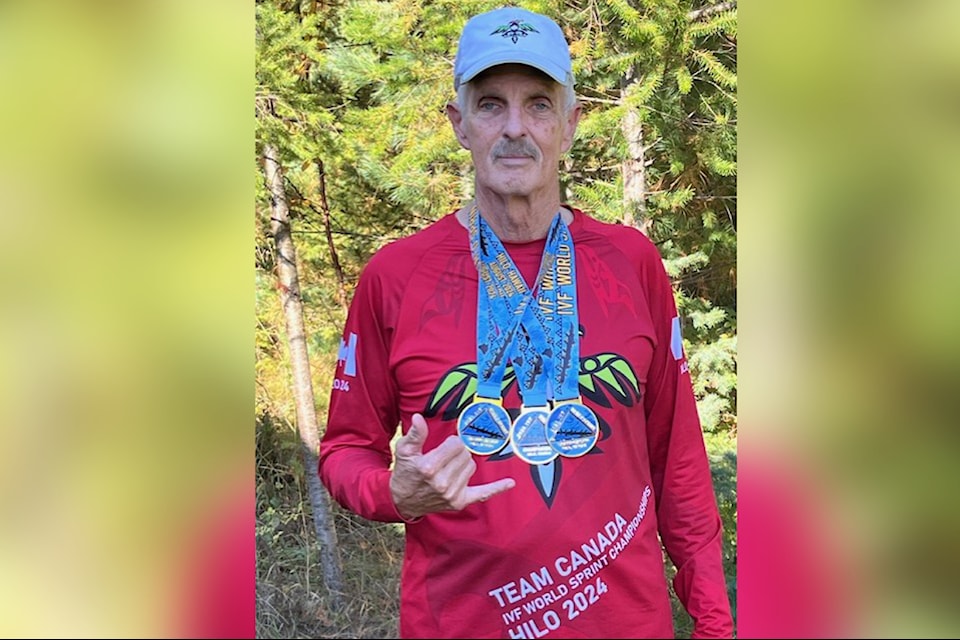 Randy Brooks wears the gold medals he and the Canadien Icemen won in three men's 70+ categories at the 2024 IVF Va’a World Elite & Club Sprints Championships, held Aug. 13-24 in Hilo, Hawaii.