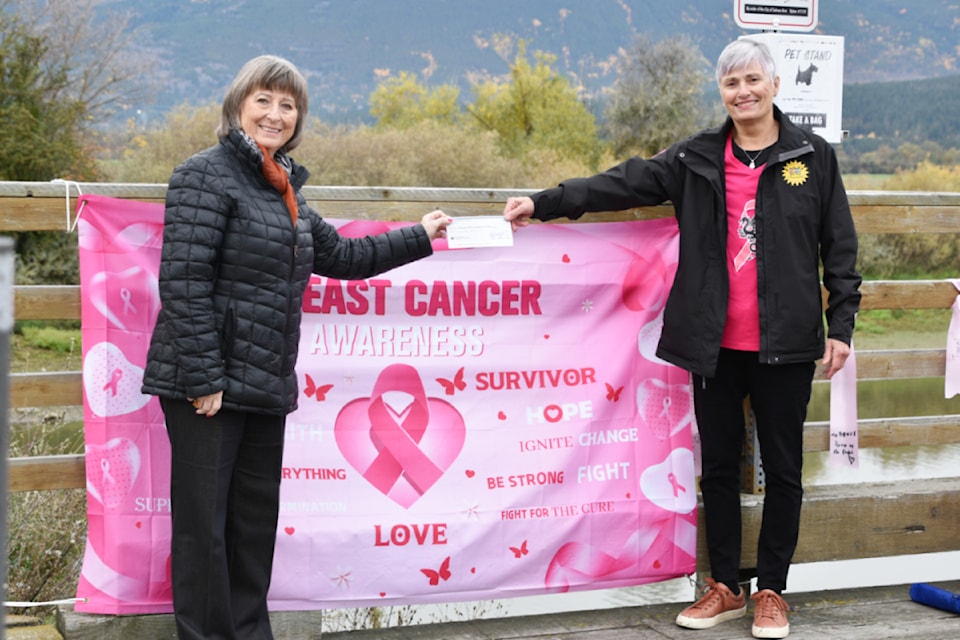 Shuswap Hospital Foundation director Fiona Harris, left, gratefully accepts a $1,317 cheque from Friends Abreast dragon boat team president Margaret Hinchliff at the Salmon Arm wharf Friday, Oct. 18.