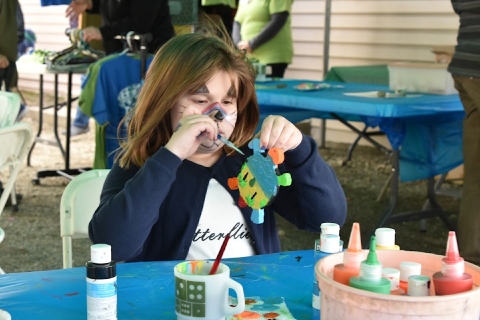 Addison Reid paints a creatively colourful critter at the 3rd Annual White Lake Turtle Festival on Saturday, April 12.