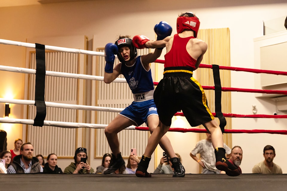 Whizbang Boxing's Carter Mills, right, takes a  jab at Tyson Dickson of Vancouver's Rebels Boxing during the Interior Series event at Salmon Arm's Song Sparrow Hall on Saturday, April 12, 2025. 
