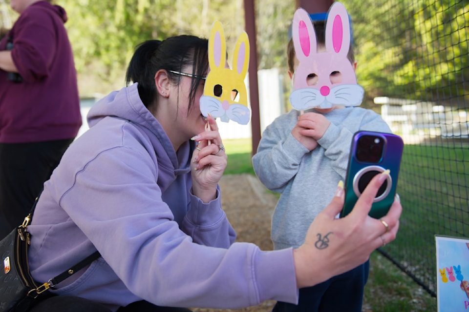 Talyssa and son Fox Taylor try on some bunny faces during the Shuswap Children's Association Early Years Easter Egg Hunt held at William Baker Park on Thursday, April 17, 2025. 