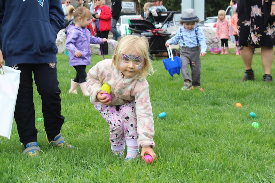 Natalie Kahanek has her hands full  while collecting treasures during the District of Sicamous' annual Easter Egg Hunt in Finlayson Park Saturday, April 19. 
