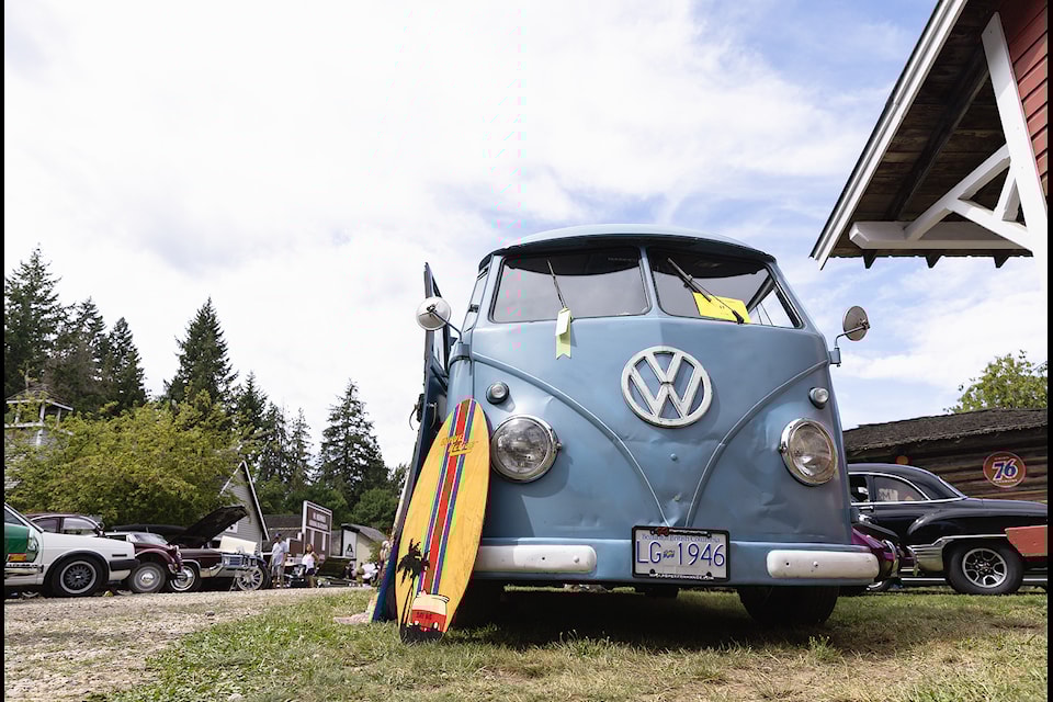 Surfing vibes surround a Volkswagen Microbus displayed at the 24th Annual Car Show at RJ Haney Heritage Village and Museum on Sunday, Aug. 11, 2025. 
