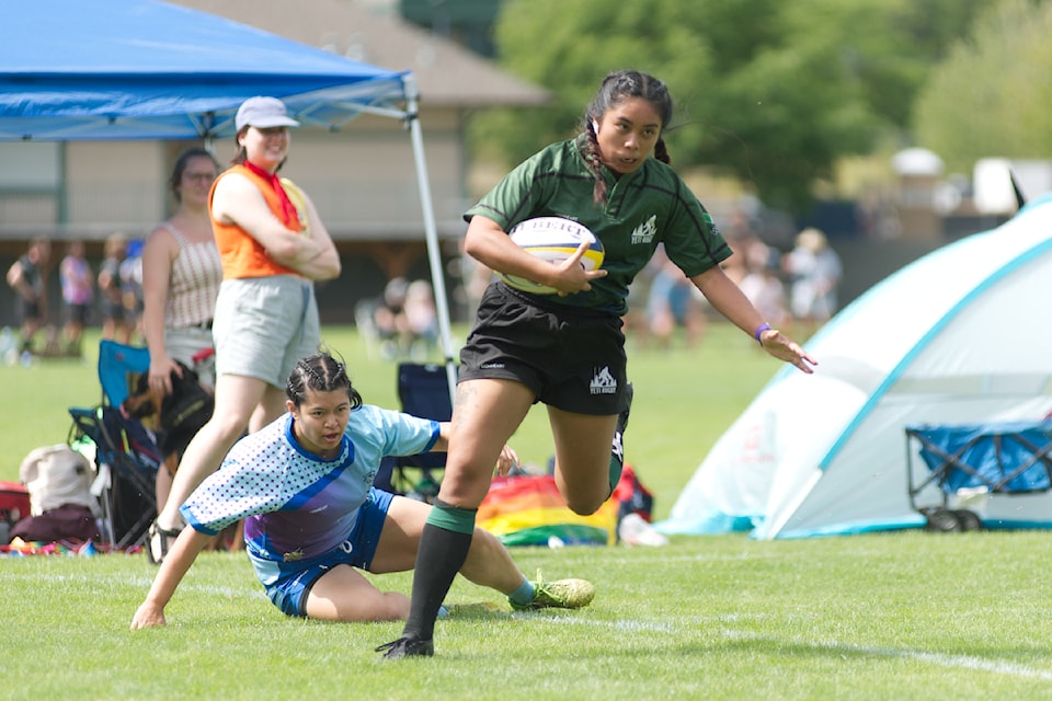 The Yeti Rugby Club's Lanie Greenhough evades a Penticton Harlequins tackler to score a try in the Salmon Arm club's first 7s round robin game of the Saratoga Cup championships at Little Mountain Sports Complex on Saturday, Aug. 9. The Yeti women dominated all of their games including the finals. 