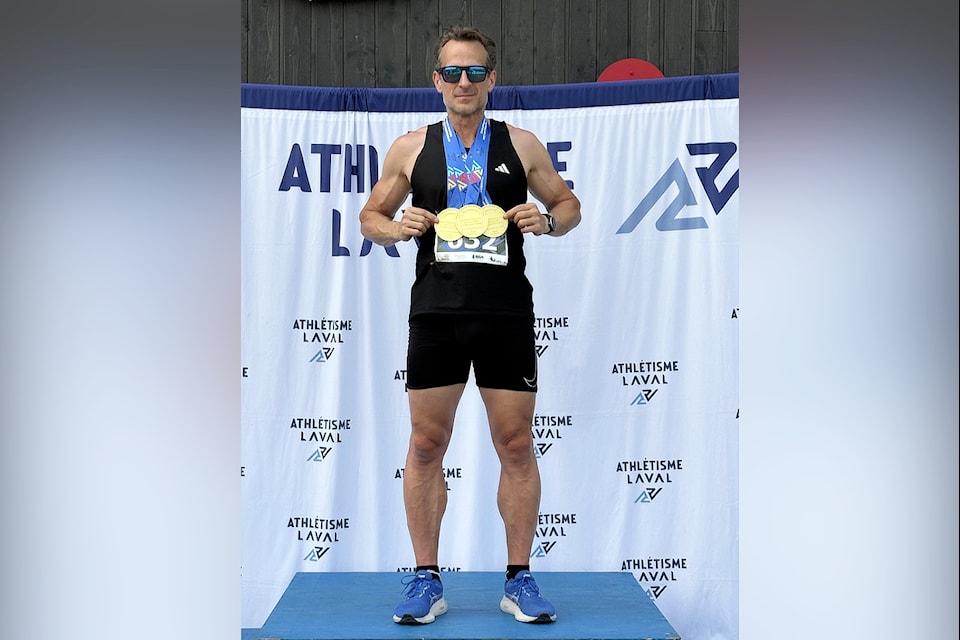 Luke Grinder sports the three gold medals he won in the 100-, 200- and 400-metre sprint in his age category at the 2025  Canadian Masters Outdoor Championships, held Aug. 1 to 3 at Laval, Quebec.