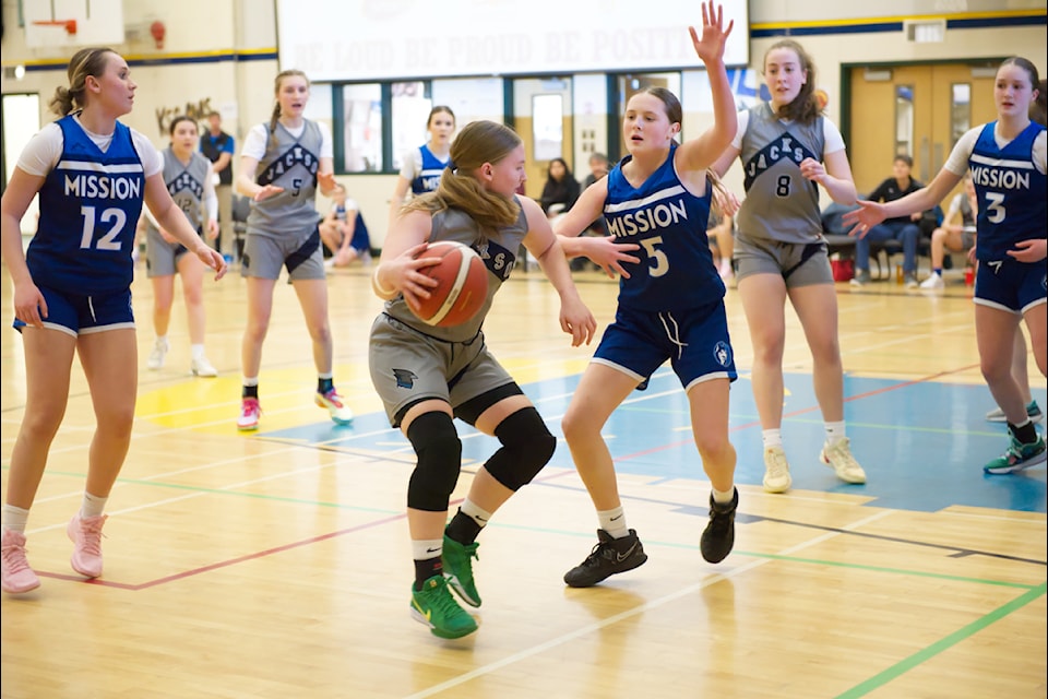 J.L. Jackson Jay Aurealia Beaumont looks for an opening while playing Okanagan Mission Secondary in the Salmon Arm team's first game in the Junior Girls Valley Championships, held in Salmon Arm on Friday and Saturday, Feb. 14 and 15. 