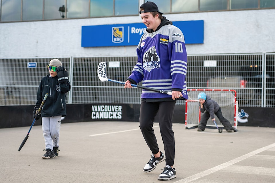 Salmon Arm Silverbacks forward Caleb Mahar enjoys some outdoor floor ball with up-and-coming hockey stars at the BCHL All-Star Weekend community festival at the Ross Street Plaza Jan. 18.