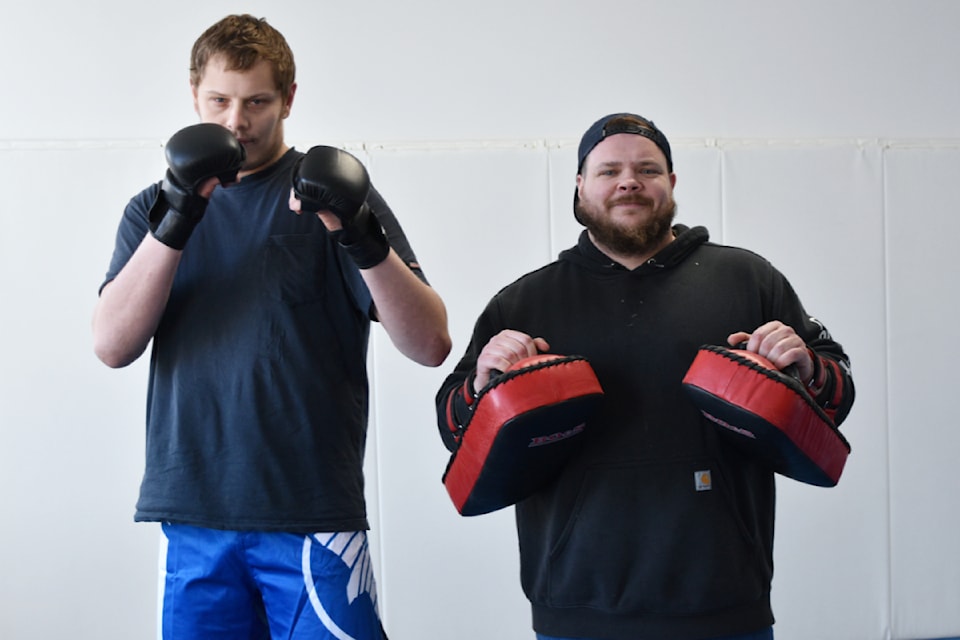 MMA fighter Devon Roper, left, is ready to take on his first official bout on Feb. 22 after training with Logan Martin at the Salmon Arm Jiu-Jitsu Academy.