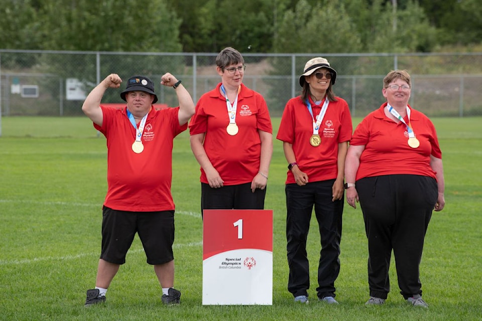 Nicholas Anchikoski celebrates a gold medal win in bocce with teammates Kathleen Nelson, Carina Chu and Heather Jolliffe at the Special Olympics BC Provincial Summer Games in Prince George July 10-12.