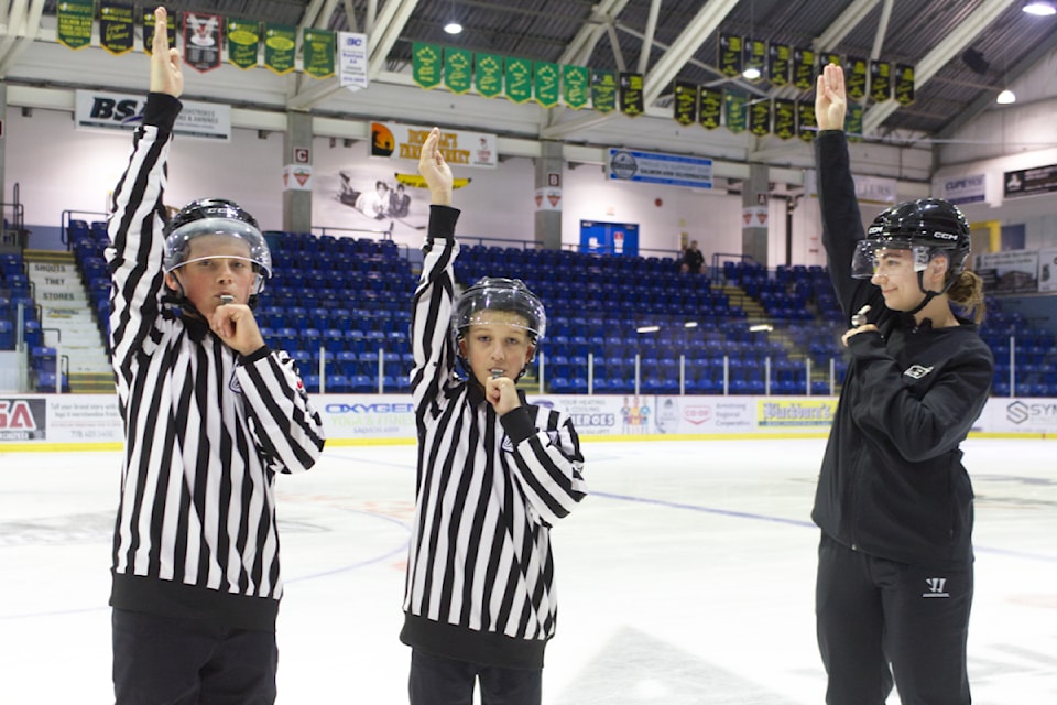 Lead instructor Taylor Pearson, right, leads Salmon Arm students Ayden Schneider, left, and Cooper Manser through some referee calls during the BC Hockey Officiating Summer School at Rogers Rink from July 31 to Aug. 4.