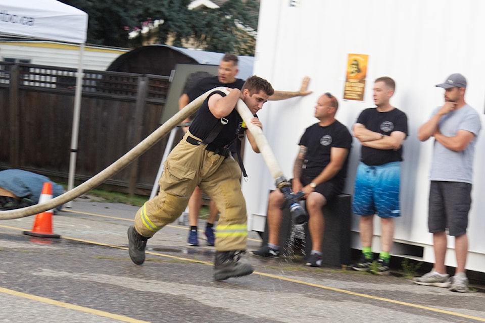 Following a record-breaking demonstration while fully kitted out, Sicamous Fire Rescue member Andrei Dumitrache gave first haul in the Hose Drag during a relay competition for the 2nd Annual Fire Fit Challenge at the hall on Aug. 5.