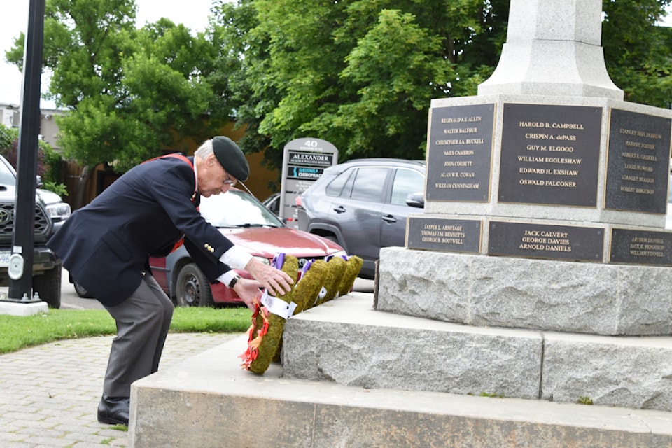 Sergeant-at-arms Walter Webster places a wreath to honour the fallen soldiers during the Salmon Arm Legion's D-Day ceremony at the cenotaph on June 6.